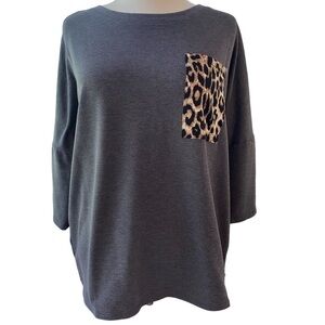 Shop Basic USA blouse short sleeve rounded neckline animal print pocket Sz large